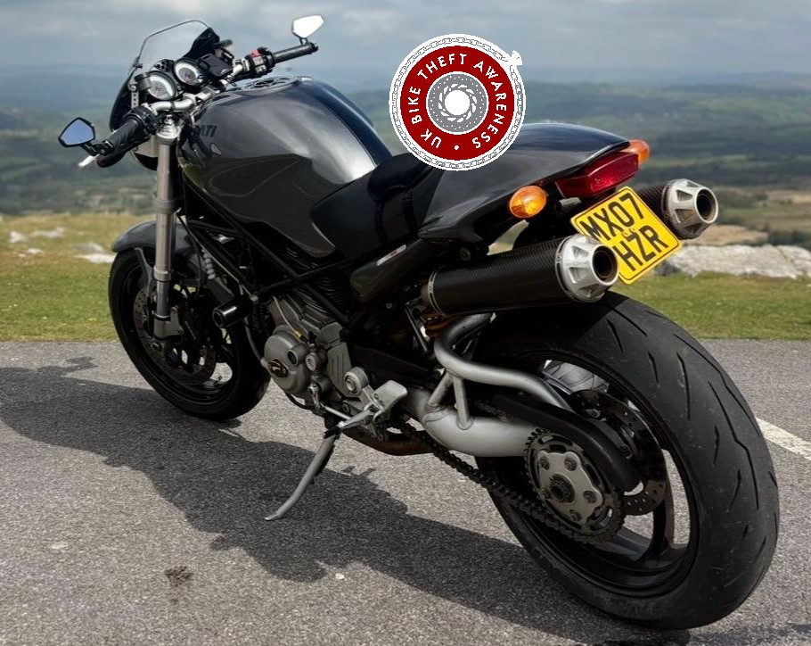 ducati monster motorcycle sat at a viewpoint